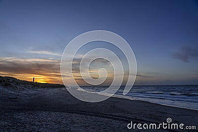 View of Hirtshals Lighthouse and beach at sunset. Hirtshals, Denmark. Stock Photo
