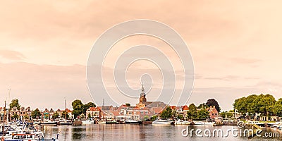 View at the historic harbor with yachts in the Dutch village of Stock Photo