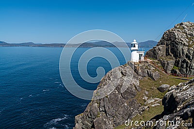 View of the historic Sheep`s Head Lighthouse on the Muntervary Peninsula in County Cork of Ireland Stock Photo