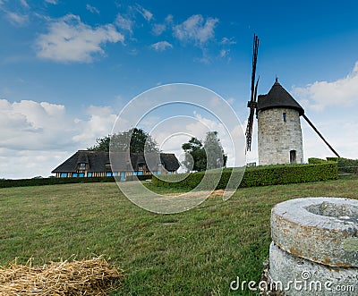 View of the historic windmill Moulin de Pierre and old millstones in Hauville in Normandy Editorial Stock Photo