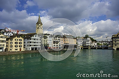 View of historic Zurich city center and turquoise water river Limmat on a cloudly day in summer, Canton of Zurich Stock Photo