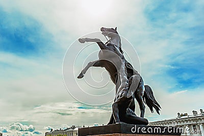 View of Horse tamers monument by Peter Klodt on Anichkov Bridge or Bridge of four horses in Saint-Petersburg Russia Stock Photo