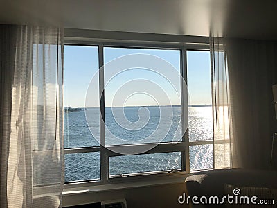 View through hotel window onto Lake Erie during summer sunset Stock Photo