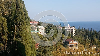 View of houses,sea and autumn trees Stock Photo