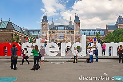 View at the I Amsterdam sign with tourists in front of the Rijksmuseum in Amsterdam Editorial Stock Photo