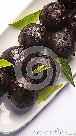 view Indulge in Kala Jamun, also known as Sweet Black Gulab. Stock Photo