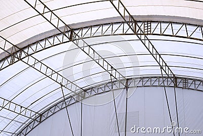 View from inside of metal roof structure with canvas of large dome event tent Stock Photo