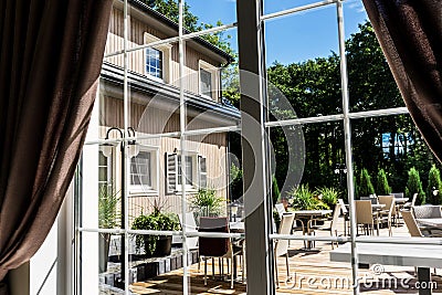 View from inside to the modern summer patio terrace Stock Photo