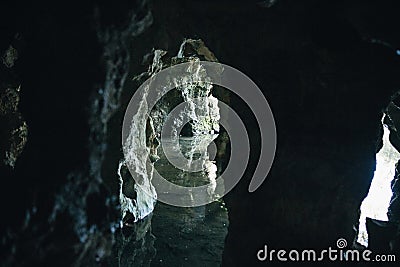 View from the inside of an underground cave flooded with water Stock Photo