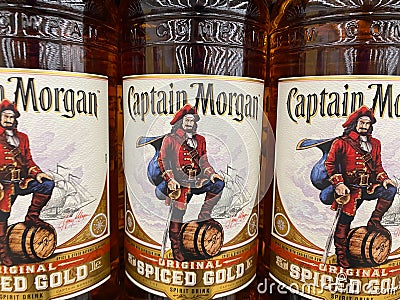 View on isolated bottle labels of jamaican Captain Morgan rum in shelf of german supermarket Editorial Stock Photo