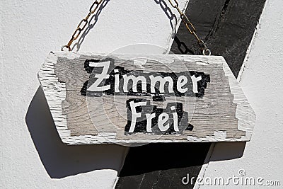 View on isolated wood sign with german text german text Editorial Stock Photo