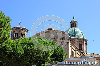 View of italian catholic roman cathedral in ravenna behind green Stock Photo