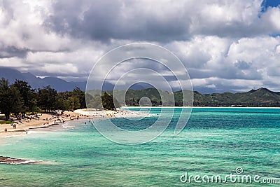 View of Kailua beach with lots of people sunbathing and swimming Stock Photo