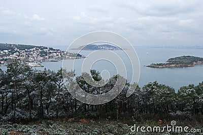 View of Kinaliada, Burgazada and Kasik Island from Heybeliada on a snowy day Stock Photo
