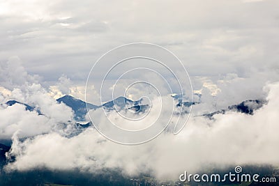 View of Kitzbueheler Alpen mountains in clouds Stock Photo