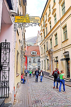 View from Kramu Street to the old buildings with one of the oldest restaurant 1221 on the Jauniela street, Old Town, Riga Editorial Stock Photo