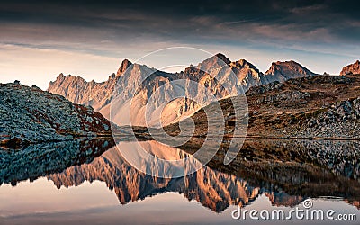 View of Lac Long with massif Des Cerces reflection on the lake in Claree valley at France Stock Photo