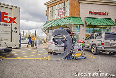 View of a lady panic shopping at Walgreens Editorial Stock Photo