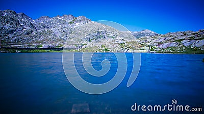 View of the lake called Della Piazza on top of the St. Gotthard pass in the Swiss Alps Stock Photo