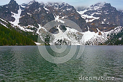 View of the lakes against the backdrop of mountains with snow Stock Photo