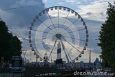 The view landmark before a summer sunset - touristic wheel with amazing view over the city Editorial Stock Photo