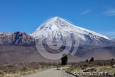 View of the Lanin Volcano from the road to Tromen Lake in Neuquen, Argentina. This volcano is covered by eternal snow Stock Photo