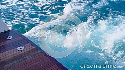 View of a large boat's stern. Yacht 's stern. Blue water footprint on the water Stock Photo