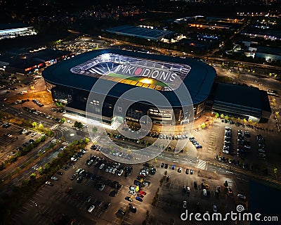 View of a large MK Dons stadium complex, illuminated at night Editorial Stock Photo