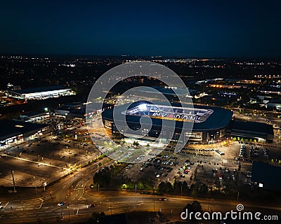 View of a large MK Dons stadium complex, illuminated at night Editorial Stock Photo