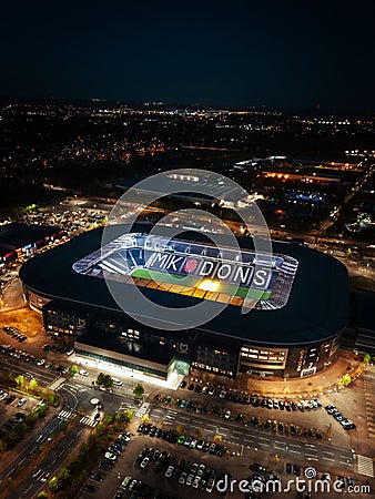 View of a large MK Dons stadium complex, illuminated at night Editorial Stock Photo