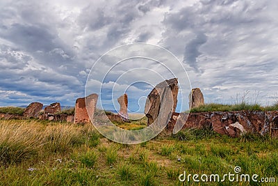 View of the large stones of the Salbyk burial mound in the steppe of Khakassia many stones Stock Photo