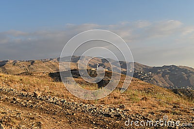 View of lebanese mountain summit of Faraya with monumental statue of Saint Charbel Stock Photo