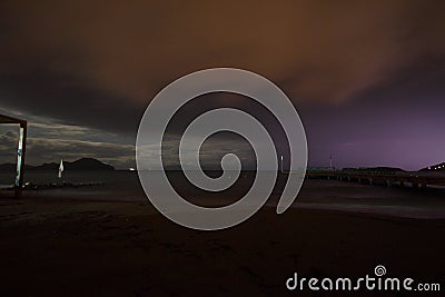 View of lightning strike over a rural farm field, lightning strikes the ground, strong thunder, lightning, dark clouds in the sky Stock Photo