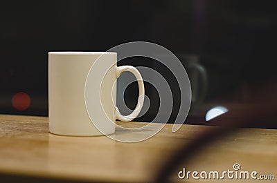 A lone single coffee cup in the window Stock Photo