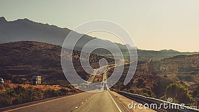 American Road Trip Long Window Road With Mountains Stock Photo