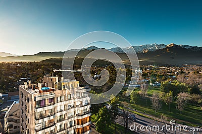 View of Los Dominicos neighborhood and Los Dominicos church and Plaza with Los Andes Mountain Range as a backdrop Editorial Stock Photo