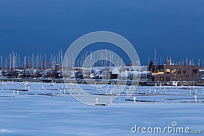 View of the Louise Basin with moored sailboats and building in the background Stock Photo