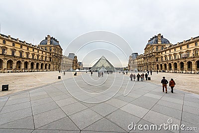 View of the Louvre Pyramid in the center of the Napoleon Courtyard of the Palais du Louvre. Editorial Stock Photo
