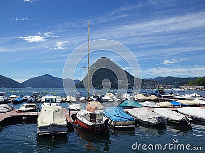 View at Lugano Lake and boats Editorial Stock Photo