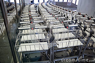 View of luggage carts in row at airport Stock Photo