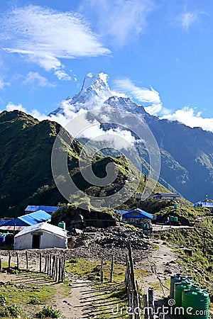 View of the Machapuchare peak in the morning, with the Mardi Himal High Camp, elevation 3550m, in the foreground, Nepal Stock Photo