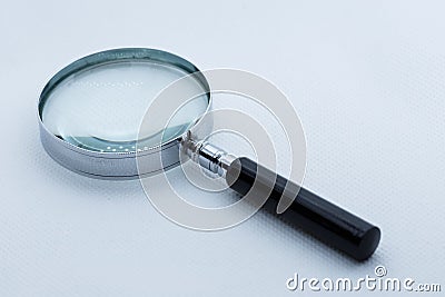 View of magnifying glass, white background Stock Photo