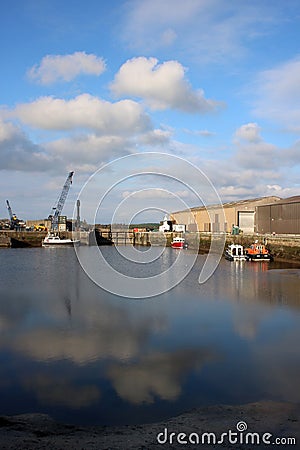 View of main basin Glasson Dock, crane and boats Stock Photo