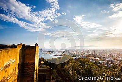 View of Malaga port, Cathedral. Alcazaba and cityscape. Tourists othe wall of Castillo de Gibralfaro Editorial Stock Photo
