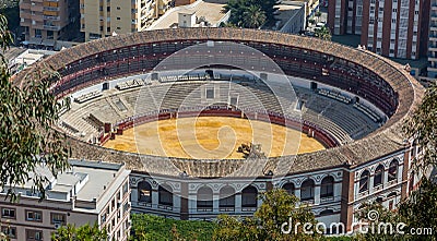 The view of Malaga`s bullring, known locally as `La Malagueta` taken from the Mirador de Gibralfaro translates to Gibralfaro View Editorial Stock Photo