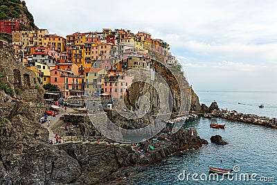 Picturesque village of Manarola with colourful houses at the edge of the cliff Riomaggiore Stock Photo