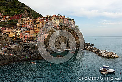 Picturesque village of Manarola with colourful houses at the edge of the cliff Riomaggiore Stock Photo