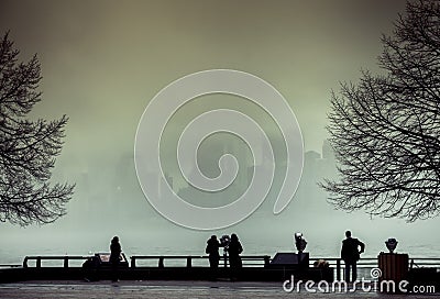 View of Manhattan, New York, from Liberty Island in a foggy day. Editorial Stock Photo