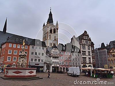 View of marketplace Hauptmarkt with weekly market in the historic center of Trier on cloudy summer day. Editorial Stock Photo