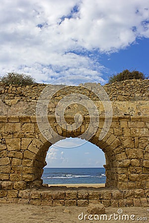 View of the Mediterranean Sea through a stone arch Stock Photo